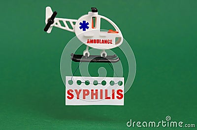 On a green surface, an ambulance helicopter with a sign - syphilis Stock Photo