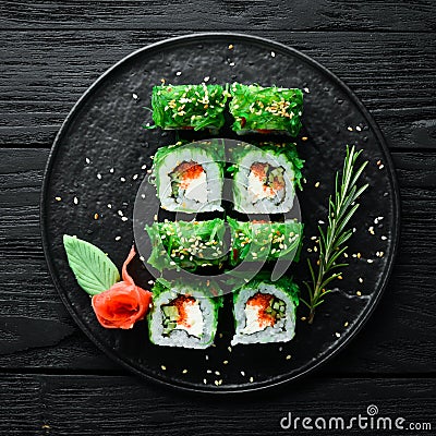 Green sushi. Japanese sushi with Chuka salad. Stock Photo