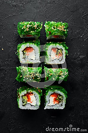 Green sushi. Japanese sushi with Chuka salad. Stock Photo