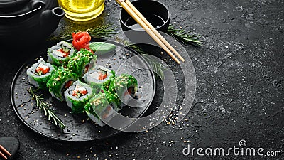 Green sushi. Japanese sushi with Chuka salad. Stock Photo