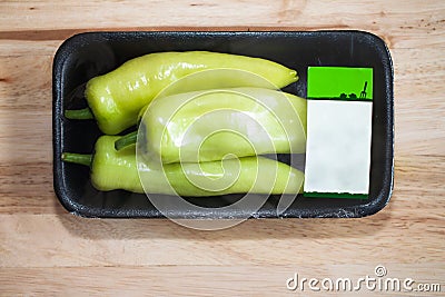 Green Sweet Pepper wrapped in package Stock Photo