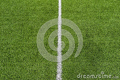 Green synthetic grass sports field with white line shot from above. Soccer, rugby, football, baseball sport concept Stock Photo