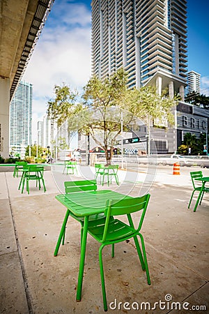 Green tables Miami Brickell Underline. Downtown city park space Stock Photo