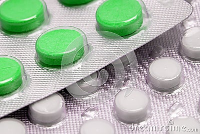 Green tablets in blister. medical drugs Stock Photo