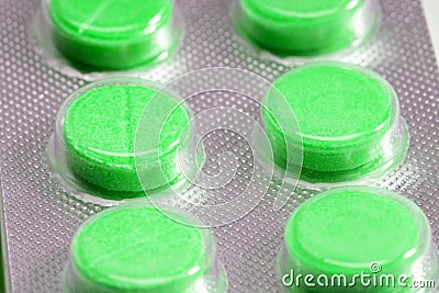 Green tablets in blister. medical drugs Stock Photo