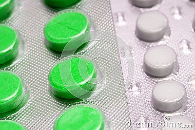 Green tablets in blister. medical drugs Stock Photo