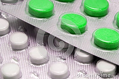 Green tablets in blister. medical drugs Stock Photo