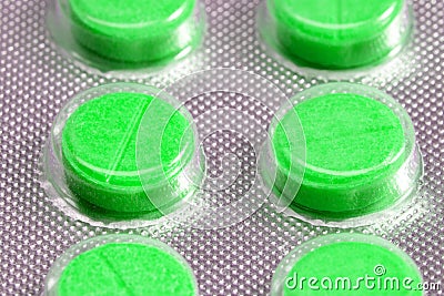 Green tablets in blister. medical drugs Stock Photo