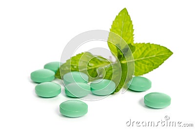 Green tablets with leaves of mint Stock Photo