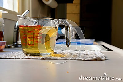 Steeping green tea bag Stock Photo