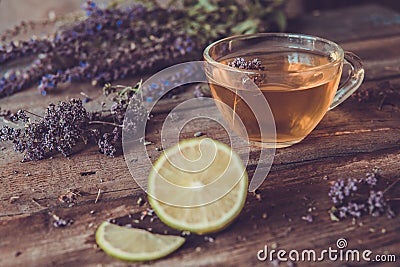 Green tea with herbals and lime. Tea with oregano on the wooden Stock Photo