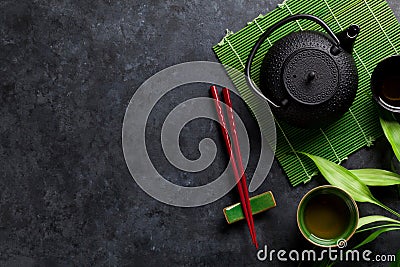 Green tea and sushi chopsticks Stock Photo