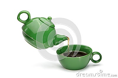 Green teapot pouring tea into a green cup Stock Photo