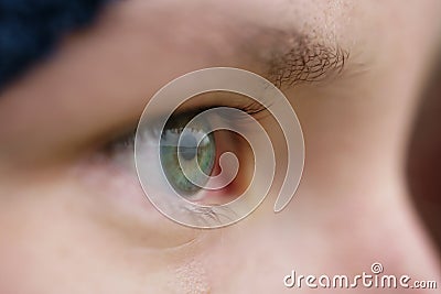 Green teen girl eye closeup front view outdoor Stock Photo