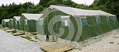 Green tent camp in Pyrenees for Santiago pilgrims Stock Photo