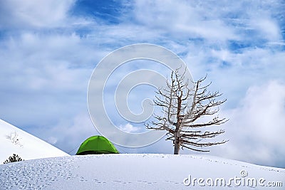 Green Tent Against Cloudy Sky In Winter Etna Park, Sicily Stock Photo