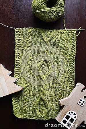 knitted scarf, hobby, the beginning of the process, handmade, needlework, green yarn, Stock Photo