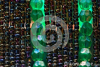 Green and tiny, shiny colored beads Stock Photo