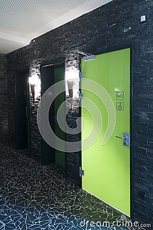 Green toilet door Stock Photo