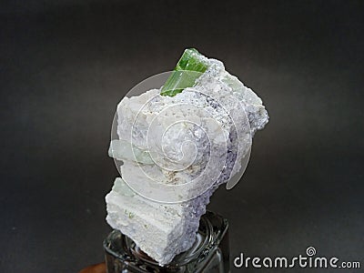 Green tourmaline with lepidolite and kunzite mineral specimen from Afghanistan Stock Photo