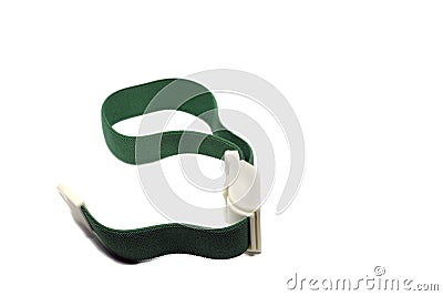 Green tourniquet band on a white background. Tourniquet as a handy tool for constricting blood vessels and veins fir IV medical ma Stock Photo