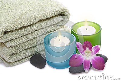 Green Towel, Orchid, Candles and Pebbles Stock Photo