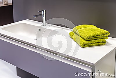 Green towels in modern bathroom Stock Photo