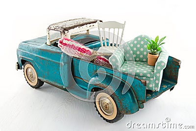 Green toy truck for moving houses Stock Photo