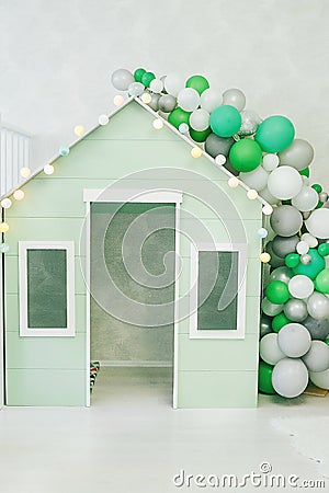 Green toy wooden children`s house Stock Photo