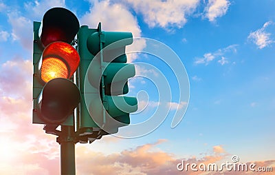 Green traffic light with burning yellow lamp supervisory Stock Photo