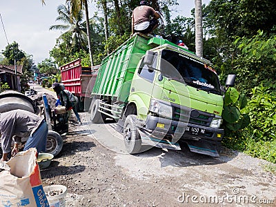 green truck tilted. Editorial Stock Photo