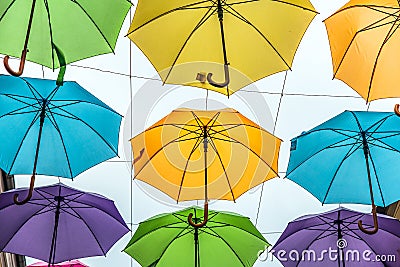 Green umbrellas on the city street in the summer Editorial Stock Photo