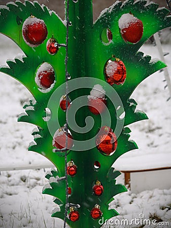 Green upside down plastic Christmas tree with red glass sphere decorations Stock Photo