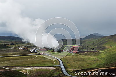 Green valley with industrial view of geothermal power station, K Stock Photo