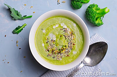 Green Vegan Broccoli Cream Soup with Non-Dairy Milk and Seed Mix, Detox Healthy Eating Stock Photo