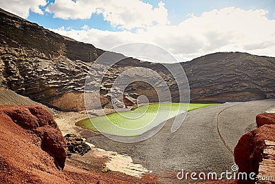 Green volcanic lake Charco de los Clicos at Lanzarote Stock Photo