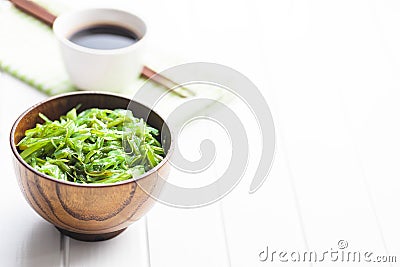 Green wakame. Seaweed salad in bowl Stock Photo
