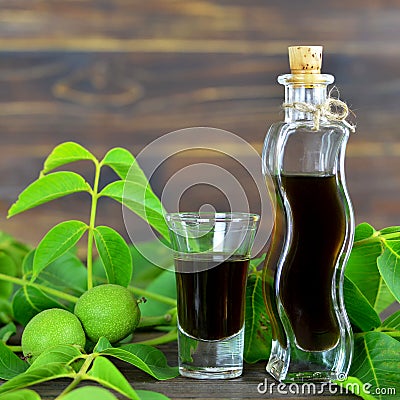 Green walnut liqueur Stock Photo