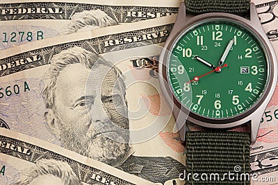 Green watch and fifty dollars Stock Photo