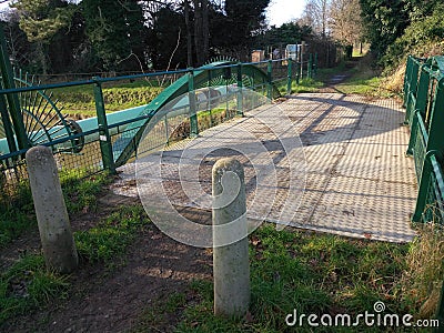 Short pedestrian bridge over a river Stock Photo