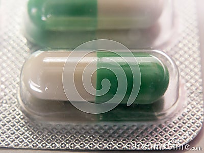 Green and white antidepressant pill in packet unopened Stock Photo
