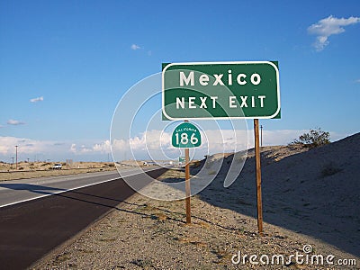 Green and White Mexico Exit Road Sign Stock Photo