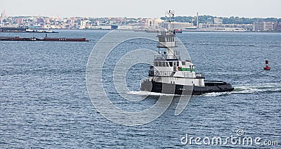 Green and White Tug Boat in New York Harbor Editorial Stock Photo