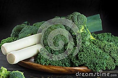 Green winter superfood - Kale green cabbage, broccoli and leeks Stock Photo