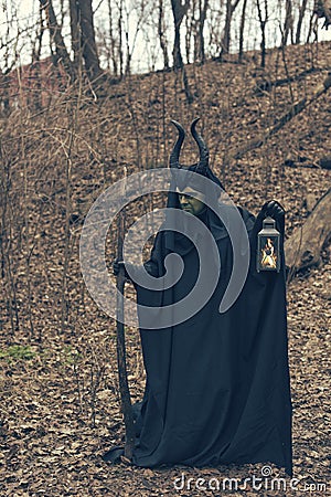 The green witch in the autumn forest Stock Photo