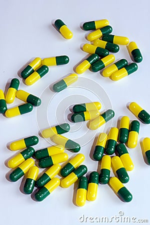 Green yellow capsule drug Stock Photo