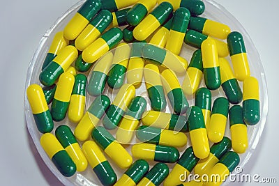 Green yellow capsule drug Stock Photo