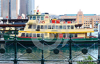 Green and yellow ferry moored in Circular Quay in Sydney NSW Australia circa June 2014 Editorial Stock Photo