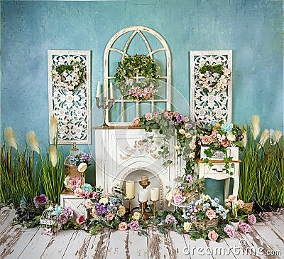 Greenery decorations with lavender, pink, blue flowers and fireplace, romantic mood Stock Photo