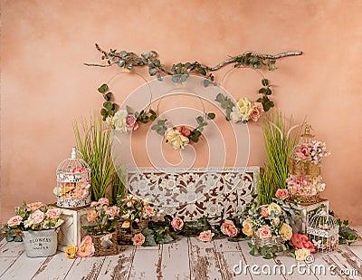 Greenery decorations with peach, somon, flowers and fireplace, romantic mood Stock Photo